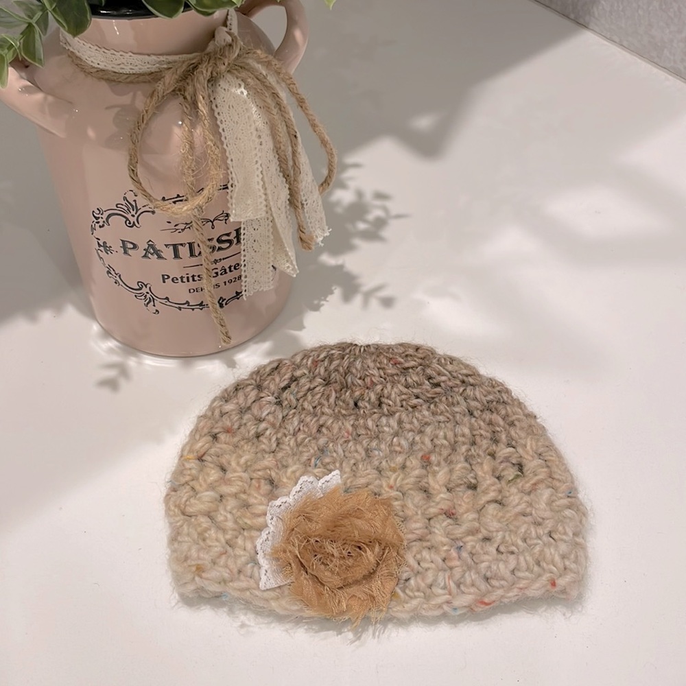 Artisan knitted infant hat. Perfect condition.